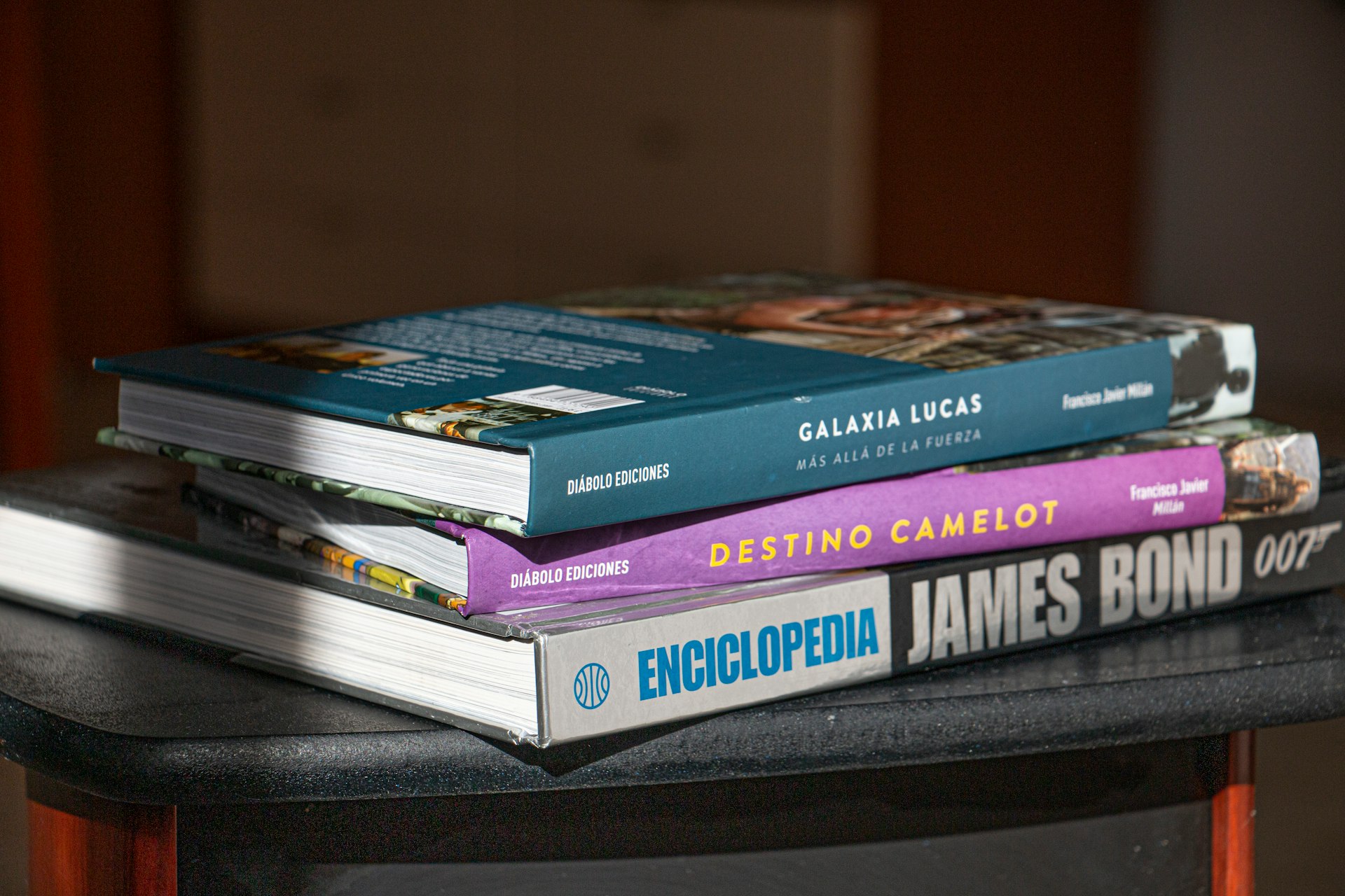a stack of books sitting on top of a table